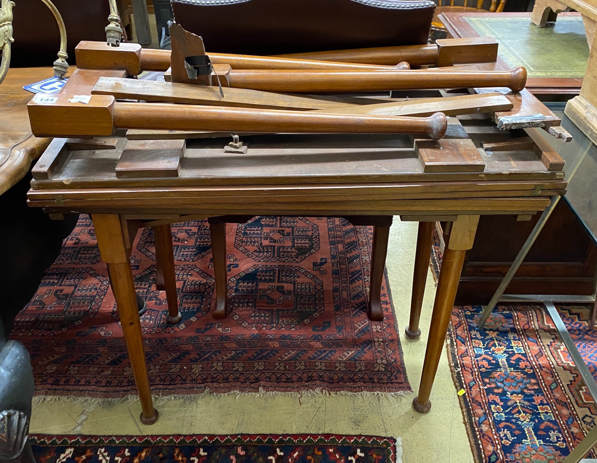 A pair of Edwardian mahogany campaign card tables, one requiring restoration, width 92cm, depth 45cm, height 73cm